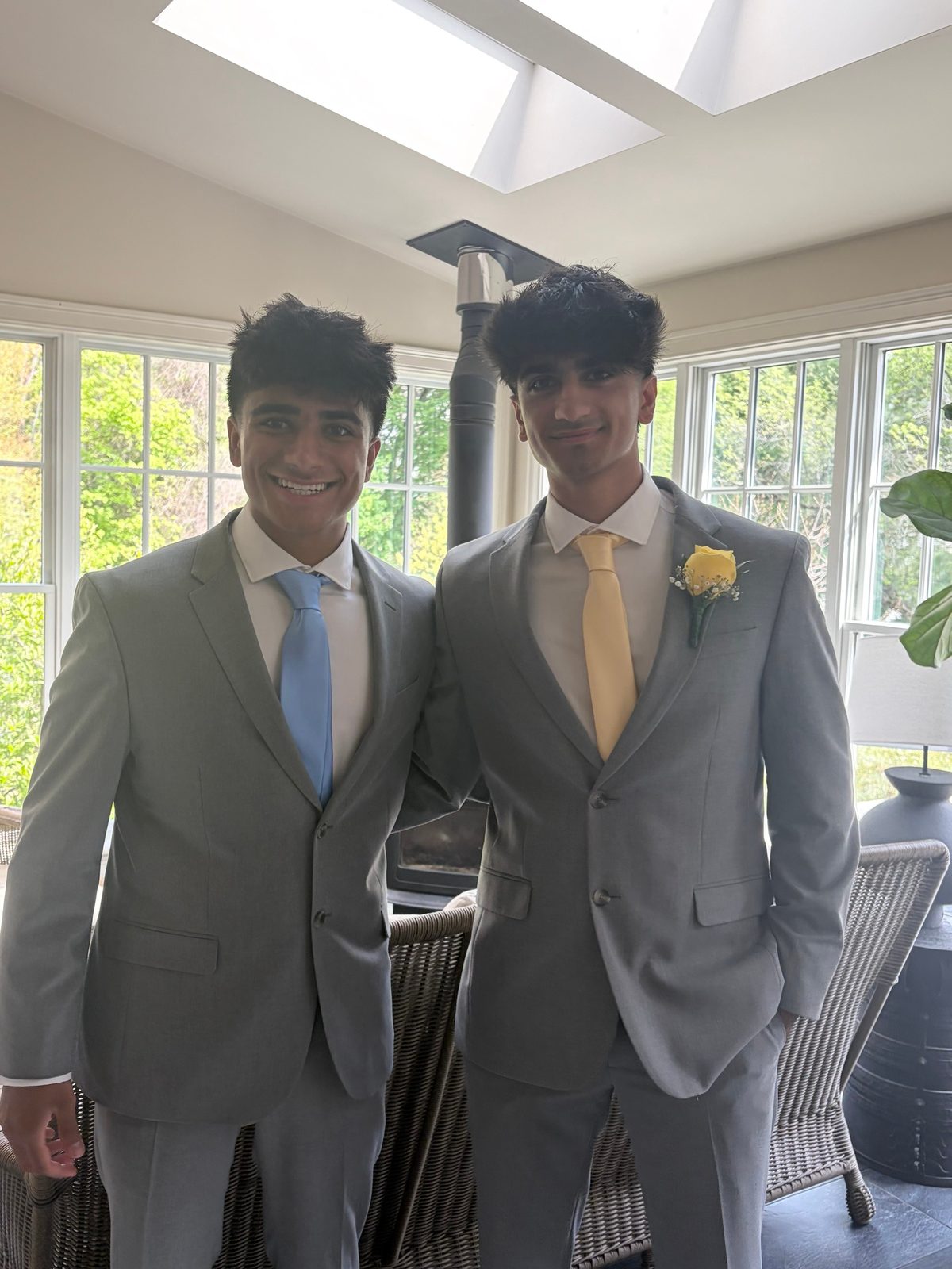 Avik and Ansh Sattiraju, the founders, in grey suits
