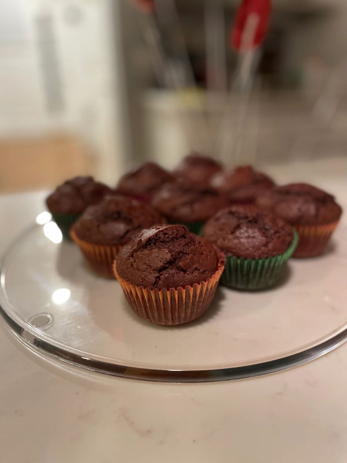 Chocolate cupcakes on a glass cake stand