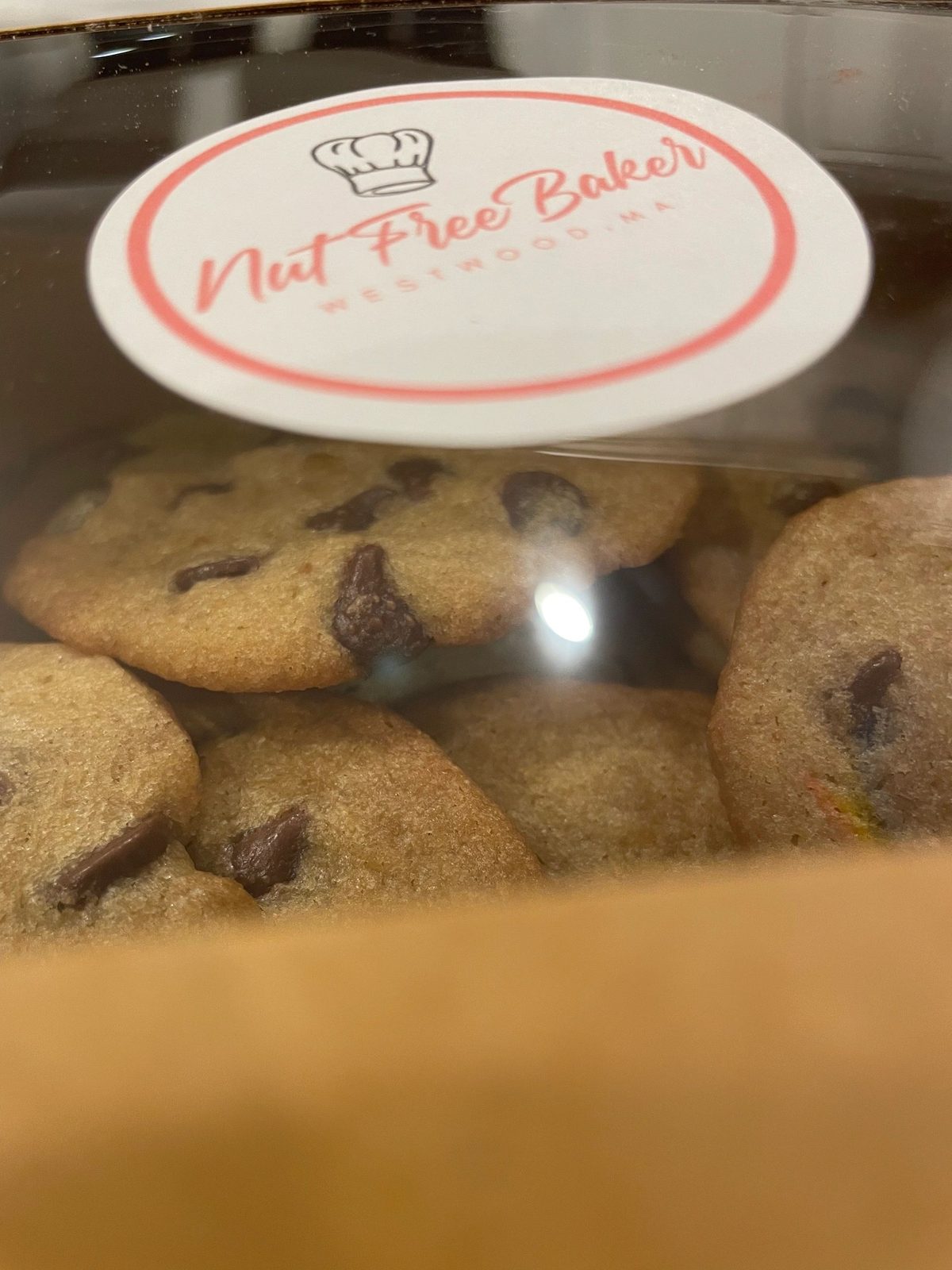 Chocolate chip cookies boxed with a Nut Free Baker sticker