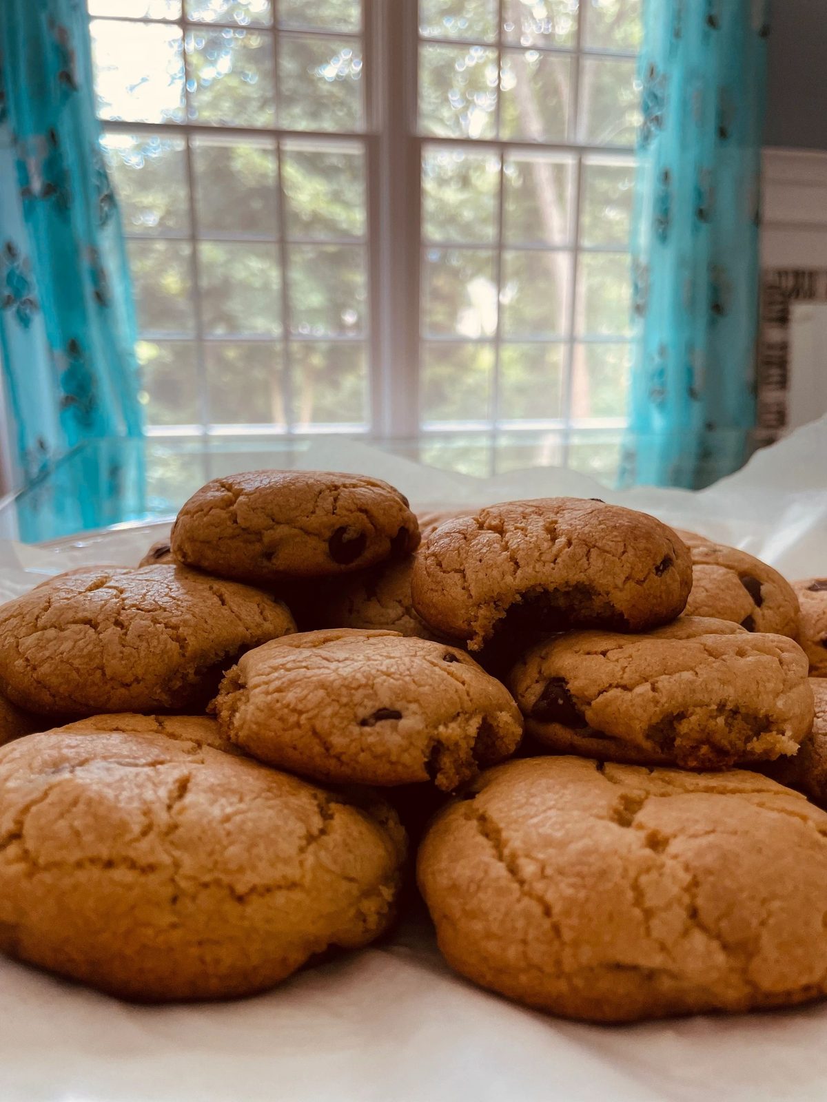 A plate of cookies by a window