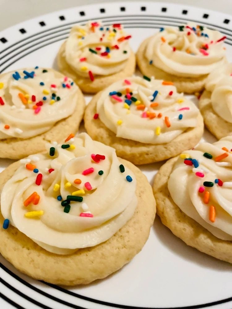 Close-up of frosted sugar cookies with sprinkles