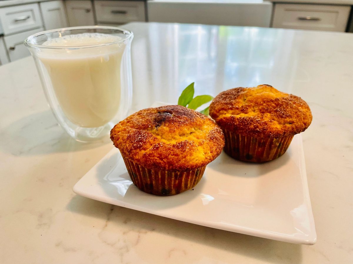 Muffins served with a glass of milk