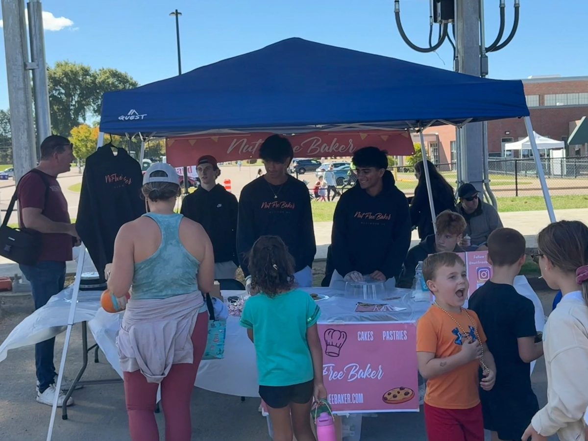 The Nut Free Baker booth busy with customers at a town day
