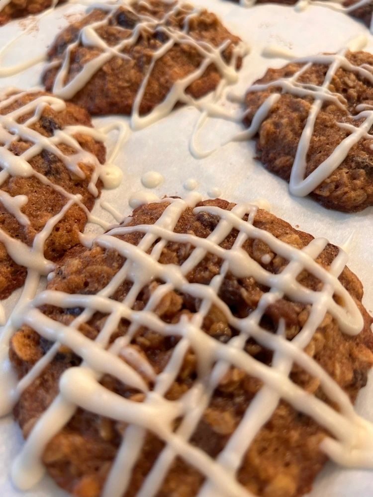 Oatmeal raisin cookies drizzled with white icing